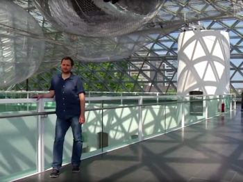 Tomás Saraceno’s "In Orbit" installation, a netted web that extends 65 feet into the air, in Germany’s K21 Staendehaus Museum.