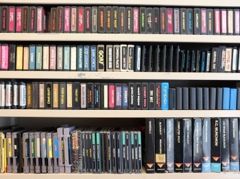Bookshelves lined with historic video games.