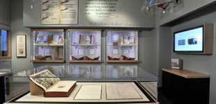 Small gallery displaying open books and documents.