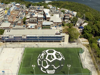 Aerial view of a soccer field painted with an image of a soccer ball.