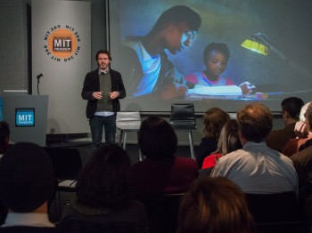 A man speaks in front of an audience at the MIT Museum.