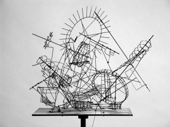 A complex mechanical device made of many metal rods in diverse shapes.