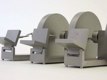 Three grey sculptures of simple seats and large discs connected by metal bars