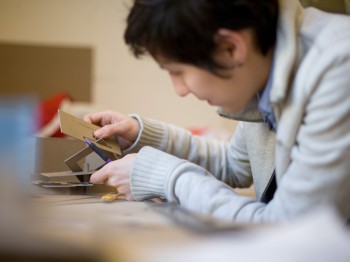 A student works with small interlocking cards.