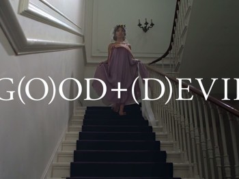 A woman in a purple dress walks down a staircase. The image includes the words "Good + Devil," where one O and the D are in parentheses
