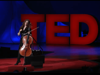 Video still of a woman with a cello speaking at a TED talk