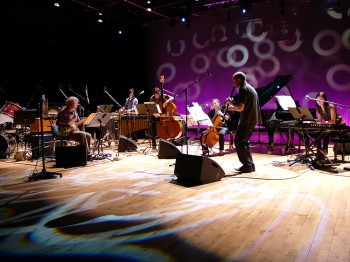 A group of musicians perform on stage