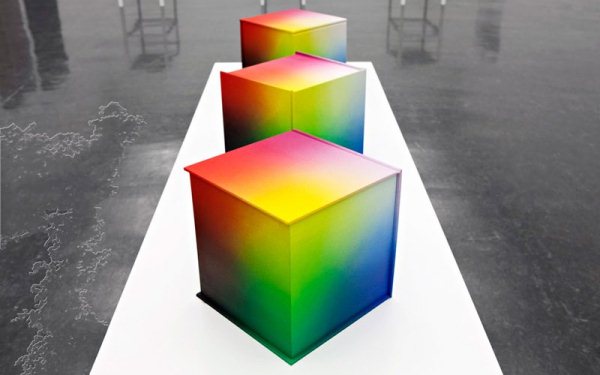 Multi-colored cube-shaped books.