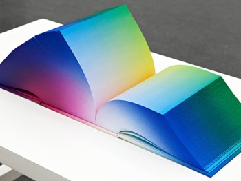 A very large book with multicolored gradients on the all pages.