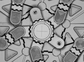 Microscopic view of interlocking geometric parts of a device.