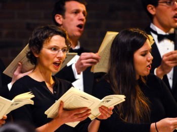 A group of choir members singing.