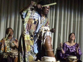 Three musicians perform with senegalese drums.