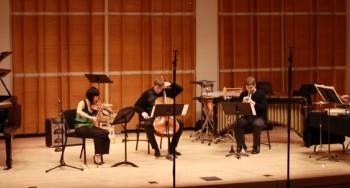 A chamber ensemble performs on stage.