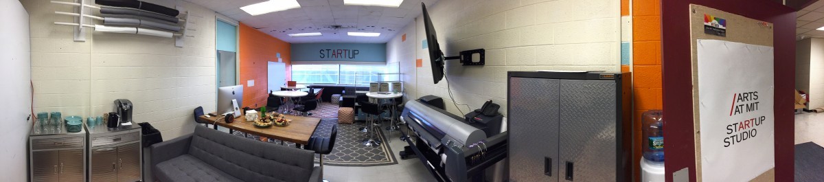 Panoramic view of the START Studio makerspace shows equipment and seating area.