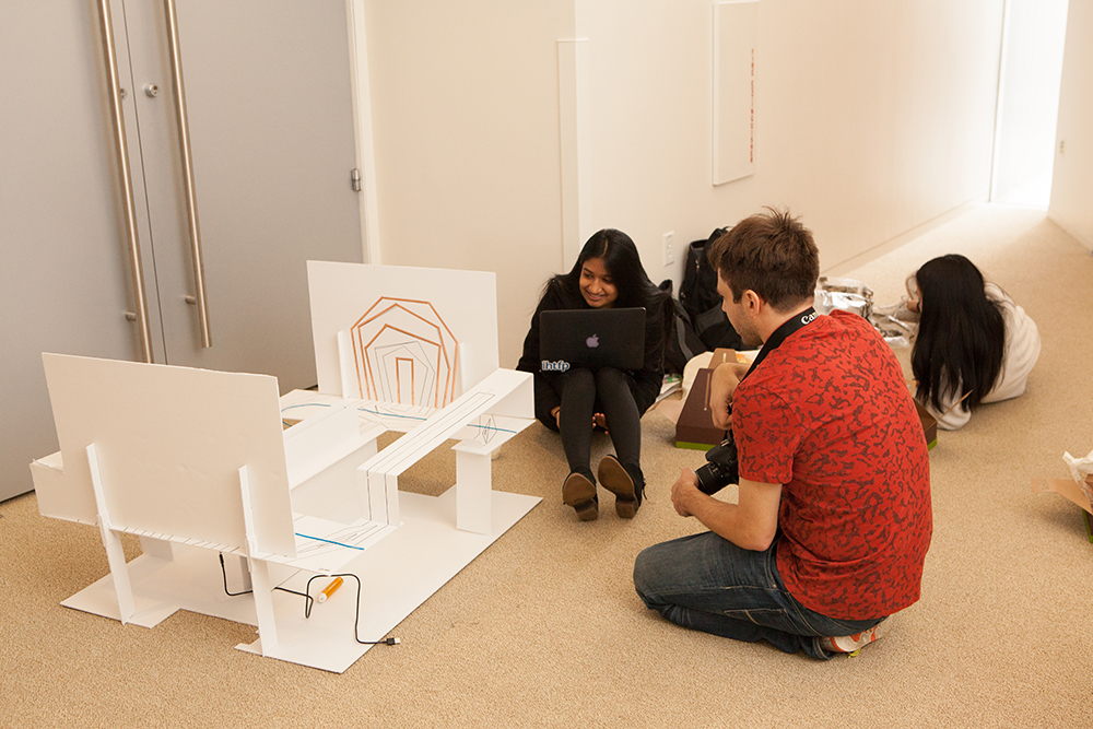 Team Möbel get feedback on their furniture from mentors Kiran Wattamwar and Christina Sun. Photo: Dana Tarr Photography.