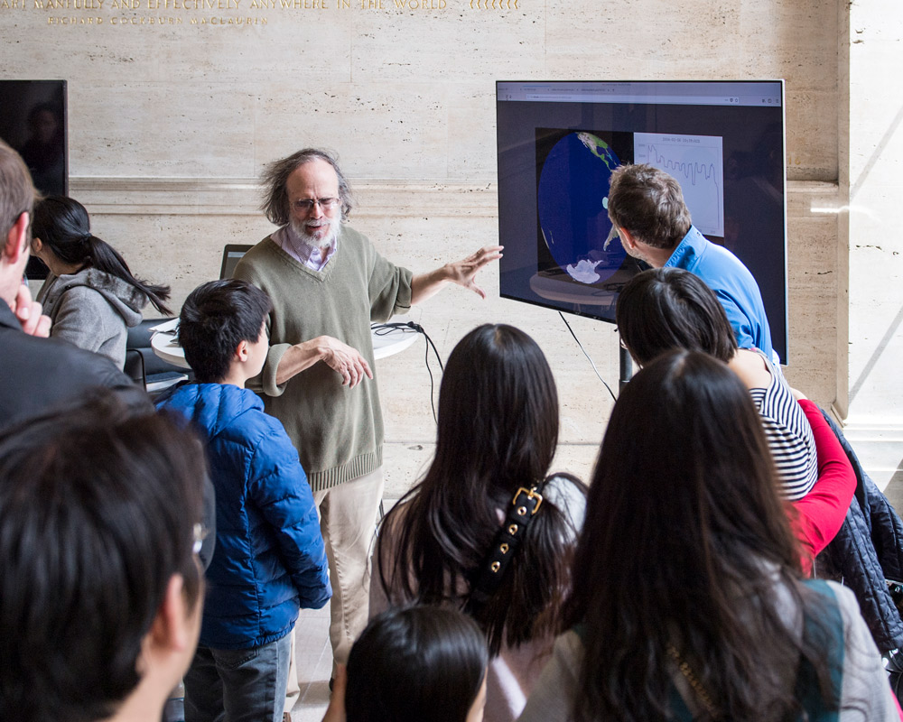EAPS faculty member Glenn R. Flierl demonstrates the Aerocene Float Predictor software with CAST Visiting Artist Tomás Saraceno, MIT Memorial Lobby, April 2018. Credit: Sham Sthankiya/MIT.