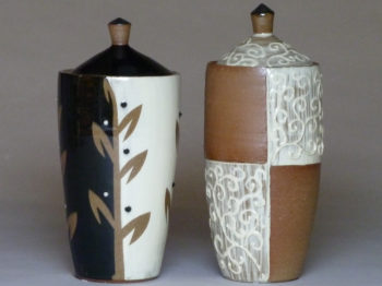 Two tall ceramic painted pots.