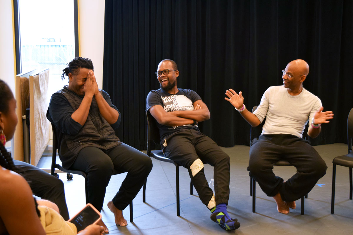 Jean Appolon, BIC, and Michel DeGraff discuss the social significance of dance and music during the “Vwayaj” Movement Workshop. Credit: HErickson/MIT.