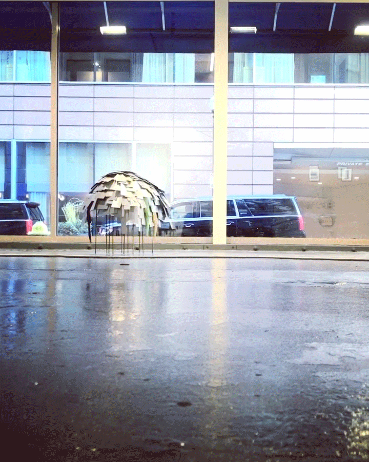 Animation of Nicole L'Huillier's The Dancer shows the sculpture moving in front of a large gallery window as cars pass outside.