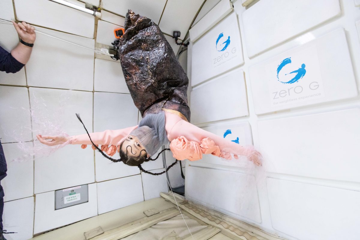 Person upside down in zero gravity