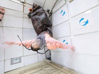 Person upside down in zero gravity