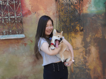 Cindy poses with a puppy