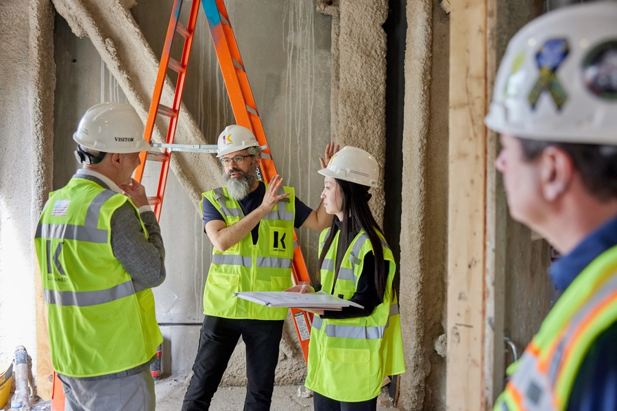 Keeril Makan (second from left), associate dean of SHASS, Michael (1949) and Sonja Koerner Music Composition Professor, and section head for MIT Music and Theater Arts; and Agustín Rayo (left), Kenan Sahin Dean of SHASS, tour the MIT Music Building construction site with Amy Hyemin Jang (second from right) from architectural firm SANAA. Credit Ken Richardson.