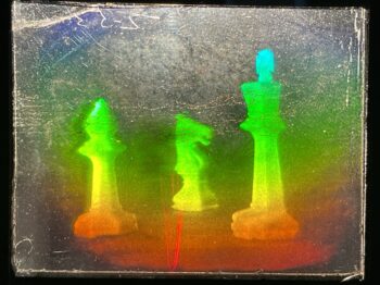 hologram of rainbow colored chess pieces