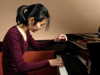 A student plays piano.