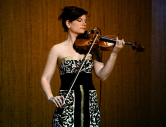 A violinist performs.