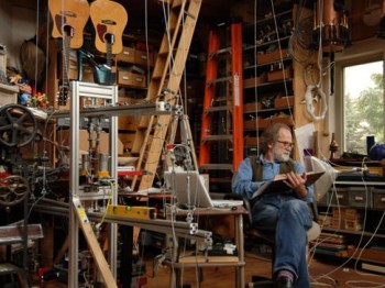 A man in an instrument-making studio.
